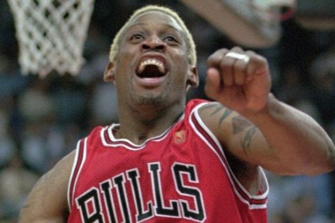 Chicago Bulls Dennis Rodman celebrates the Bulls 96-95 win over the Washington Bullets to sweep the first round NBA playoff series in Landover, Md., Wednesday, April 30, 1997.(AP Photo/Roberto Borea)