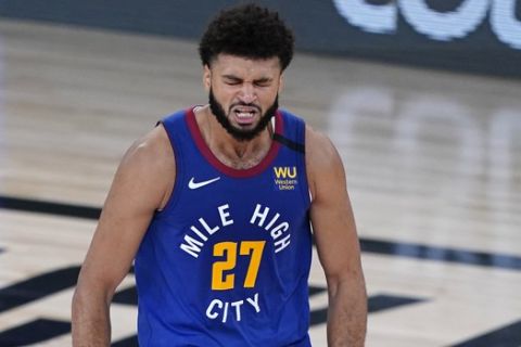 Denver Nuggets' Jamal Murray reacts after making a 3-pointer against the Utah Jazz during the second half of an NBA basketball first round playoff game Sunday, Aug. 30, 2020, in Lake Buena Vista, Fla. (AP Photo/Ashley Landis)