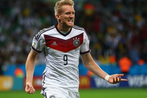 PORTO ALEGRE, BRAZIL - JUNE 30:  Andre Schuerrle of Germany celebrates scoring his team's first goal  in extra time during the 2014 FIFA World Cup Brazil Round of 16 match between Germany and Algeria at Estadio Beira-Rio on June 30, 2014 in Porto Alegre, Brazil.  (Photo by Jamie Squire/Getty Images)
