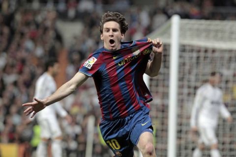 FC Barcelona's Lionel Messi of Argentina celebrates his goal against Real Madrid during a Spanish La Liga soccer match at the Santiago Bernabeu Stadium in Madrid Saturday, Abril, 10, 2010. (AP Photo/Andres Kudacki)