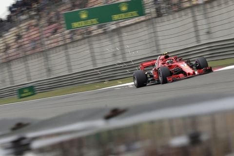 Ferrari driver Kimi Raikkonen of Finland steers his car during the third practice session for the Chinese Formula One Grand Prix at the Shanghai International Circuit in Shanghai, Saturday, April 14, 2018. (AP Photo/Andy Wong)