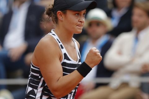 Australia's Ashleigh Barty clenches her fist after scoring a point against Marketa Vondrousova of the Czech Republic during the women's final match of the French Open tennis tournament at the Roland Garros stadium in Paris, Saturday, June 8, 2019. (AP Photo/Michel Euler)