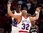 PHILADELPHIA - 1992:  Charles Barkley #32 of the Philadelphia 76ers celebrates with his teammate Manute Bol #11 during a game played in 1992 at the Spectrum in Philadelphia, Pennsylvania.  NOTE TO USER: User expressly acknowledges and agrees that, by downloading and/or using this Photograph, user is consenting to the terms and conditions of the Getty Images License Agreement.  Mandatory Copyright Notice:  Copyright 1992 NBAE  (Photo by Nathaniel S. Butler/NBAE via Getty Images)