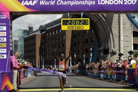 Kenya's Geoffrey Kipkorir Kirui celebrates as he crosses the line to win the gold medal in the Men's Marathon during the World Athletics Championships Sunday, Aug. 6, 2017.(AP Photo/Tim Ireland)