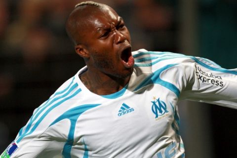 Marseille's forward Djibril Cisse reacts after he scored against Lyon, during their French League one soccer match in Marseille, southern France, Sunday, April 6, 2008. (AP Photo/Claude Paris)