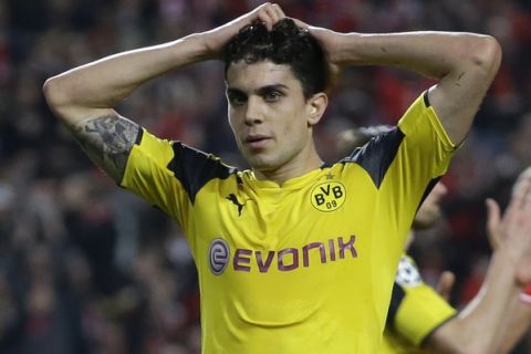 FILE - In this file photo dated Tuesday, Feb. 14, 2017, Dortmund's Marc Bartra reacts during the Champions League round of 16, first leg, soccer match between Benfica and Borussia Dortmund at the Luz stadium in Lisbon. Borussia Dortmund said Tuesday April 11, 2017, defender Marc Bartra was injured in an explosion near team bus and is currently in a hospital. (AP Photo/Armando Franca, FILE)