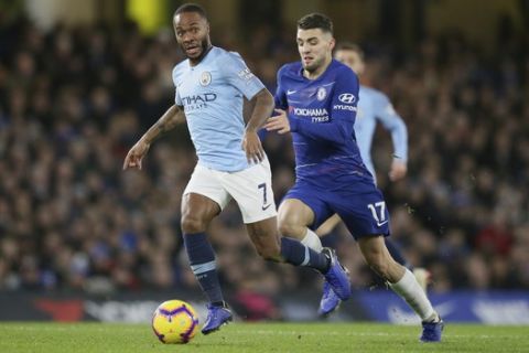 Manchester City's Raheem Sterling, left, runs with the ball following by Chelsea's Mateo Kovacic during the English Premier League soccer match between Chelsea and Manchester City at Stamford Bridge in London, Saturday Dec. 8, 2018. (AP Photo/Tim Ireland)