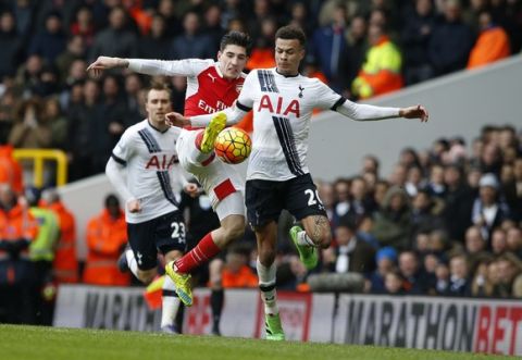 Tottenham Hotspurs Dele Alli, right, is challenged by Arsenal's Hector Bellerin during the English Premier League soccer match between Tottenham Hotspur and Arsenal at the White Hart Lane stadium in London, Saturday, March, 5, 2016. (AP Photo/Alastair Grant)