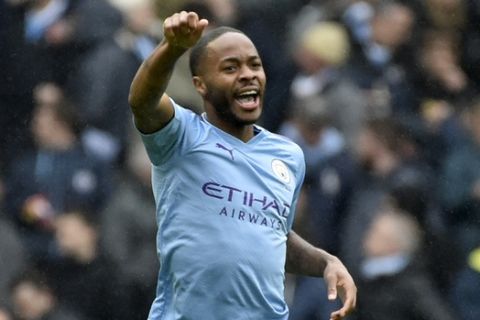 Manchester City's Raheem Sterling celebrates after scoring his side's first goal during the English Premier League soccer match between Manchester City and Aston Villa at Etihad stadium in Manchester, England, Saturday, Oct. 26, 2019. (AP Photo/Rui Vieira)