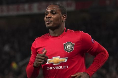 Manchester United's Odion Ighalo celebrates after scoring his side's second goal during the round of 32 second leg Europa League soccer match between Manchester United and Brugge at Old Trafford in Manchester, England, Thursday, Feb. 27, 2020. (AP Photo/Dave Thompson)