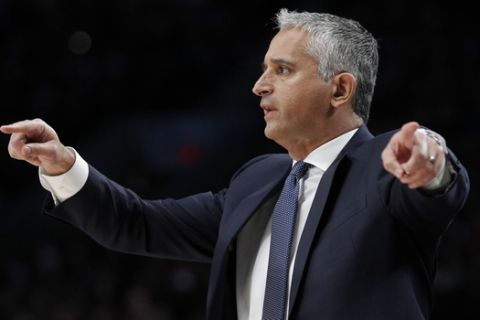 Phoenix Suns coach Igor Kokoskov signals in a play during the first half of the team's NBA basketball game against the Portland Trail Blazers in Portland, Ore., Saturday, March 9, 2019. (AP Photo/Steve Dipaola)
