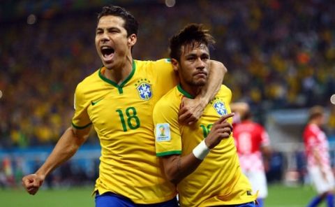 SAO PAULO, BRAZIL - JUNE 12: Hernanes (L) and Neymar of Brazil celebrat scoring his second goal on a penalty kick in the second half during the 2014 FIFA World Cup Brazil Group A match between Brazil and Croatia at Arena de Sao Paulo on June 12, 2014 in Sao Paulo, Brazil. (Photo by Amin Mohammad Jamali/Getty Images)