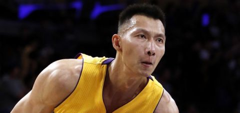 Los Angeles Lakers forward Yi Jianlian (11), of China, pulls up to shoot against the Portland Trail Blazers during the second half of an NBA preseason basketball game in Los Angeles, Tuesday, Oct. 11, 2016. (AP Photo/Alex Gallardo)