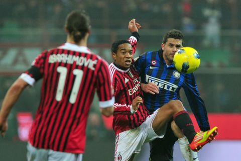 AC Milan's Brazilian midfielder Urby Emanuelson (C) fights for the ball with Inter Milan's Brazilian midfielder Thiago Motta (R) on January 15, 2012 during a Serie A football match at the San Siro stadium in Milan. AFP PHOTO / GIUSEPPE CACACE (Photo credit should read GIUSEPPE CACACE/AFP/Getty Images)
