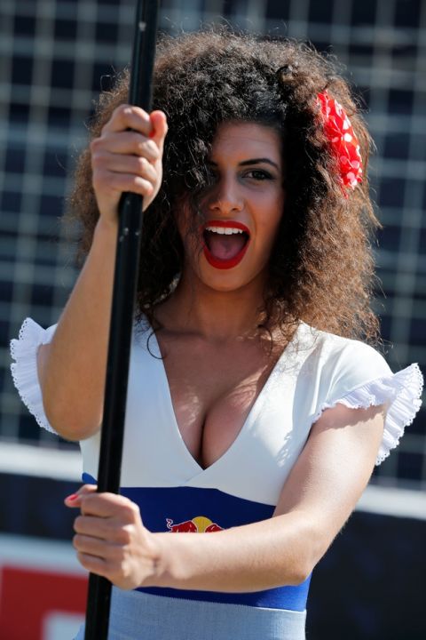 A grid girl poses for the camera during Spain's Motorcycle Grand Prix at the Jerez race track in Jerez de la Frontera, southern Spain, Sunday, April 24, 2016. (AP Photo/Miguel Angel Morenatti)