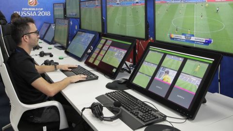 VAR refereeing Project Leader Roberto Rosetti, left, demonstrates a video operation room (VOR), a facility of the Video Assistant Referee (VAR) system which will be rolled out for the first time during theWorld Cup, at the 2018 World Cup International Broadcast Centre in Moscow, Russia, Saturday, June 9, 2018. (AP Photo/Dmitri Lovetsky)
