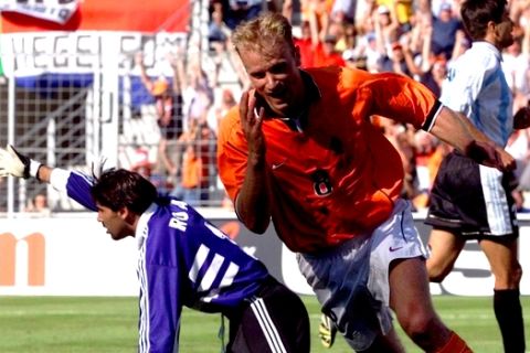 Holland's Dennis Bergkamp jubilates after scoring the winning goal against Argentina's goalkeeper Carlos Roa during the quarter final France 98 soccer world cup match Argentina vs. the Netherlands at the Velodrome stadium in Marseille Saturday  July 4, 1998. Holland won 2-1 and will meet Brazil in the semi-finals. (AP Photo/Ricardo Mazalan)