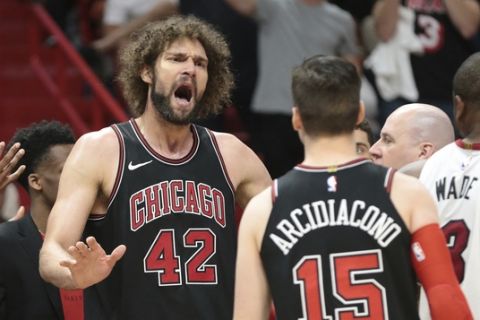 Chicago Bulls center Robin Lopez (42) reacts after receiving two technical fouls and being ejected from an NBA basketball game against the Miami Heat during the second half Thursday, March 29, 2018, in Miami. (AP Photo/Joel Auerbach)