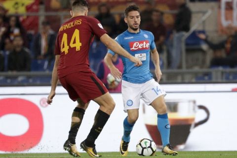 Napoli's Dries Mertens takes on Roma's Kostas Manolas during a Serie A soccer match between Roma and Napoli, at the Rome Olympic Stadium, Saturday, Oct. 14, 2017. (AP Photo/Andrew Medichini)