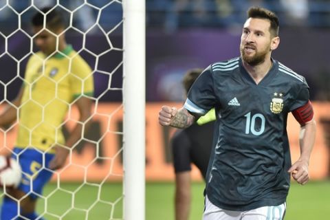 Argentina's Lionel Messi celebrates after scoring his side's opening goal during a friendly soccer match between Brazil and Argentina at King Fahd stadium in Riyadh, Saudi Arabia, Friday, Nov. 15, 2019. (AP Photo)