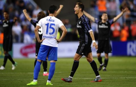 Real Madrid's Cristiano Ronaldo celebrates at the end of a Spanish La Liga soccer match between Malaga and Real Madrid in Malaga, Spain, Sunday, May 21, 2017. Real Madrid wins the Spanish league for the first time in five years, avoiding its biggest title drought since the 1980s. (AP Photo/Daniel Tejedor)