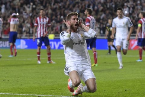 Real's Sergio Ramos, gestures, after scoring his side's first goal , during the Champions League final soccer match between Atletico Madrid and Real Madrid, at the Luz stadium, in Lisbon, Portugal, Saturday, May 24, 2014. (AP Photo/Manu Fernandez)
