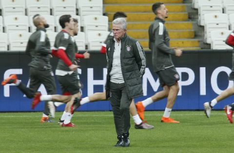 Bayern Munich's coach Jupp Heynckes walks on the pitch as his players warm-up during a training session in Istanbul, Tuesday, March 13, 2018, ahead of their team's Champions League round of 16 second leg soccer match against Besiktas Wednesday. (AP Photo/Lefteris Pitarakis)