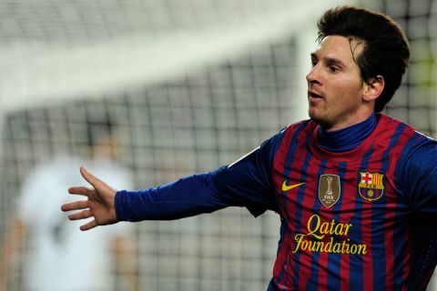 Barcelona's Argentinian forward Lionel Messi celebrates after scoring a goal during the Spanish league football match between FC Barcelona and Valencia CF on February 19, 2012, at the Camp Nou stadium in Barcelona. AFP PHOTO / JOSEP LAGO (Photo credit should read JOSEP LAGO/AFP/Getty Images)