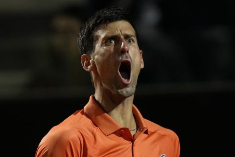 Serbia's Novak Djokovic shouts during his semifinal match against Norway's Casper Ruud at the Italian Open tennis tournament, in Rome, Saturday, May 14, 2022. (AP Photo/Alessandra Tarantino)