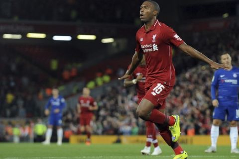 Liverpool's Daniel Sturridge celebrates after scoring his side's opening goal during the English League Cup soccer match between Liverpool and Chelsea at Anfield stadium in Liverpool, England, Wednesday, Sept. 26, 2018. (AP Photo/Rui Vieira)