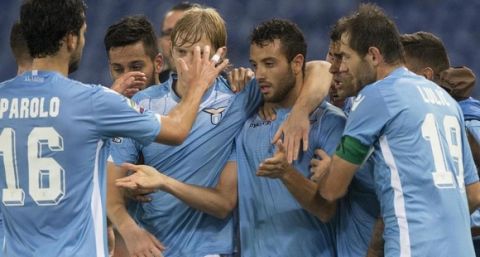 Lazio's Felipe Anderson jubilates with his teammates after scoring the 2-0 goal during serie A soccer match s.s. Lazio vs Genoa Cfc at Olympic Stadium in Rome, 23 September 2015. ANSA/CLAUDIO PERI