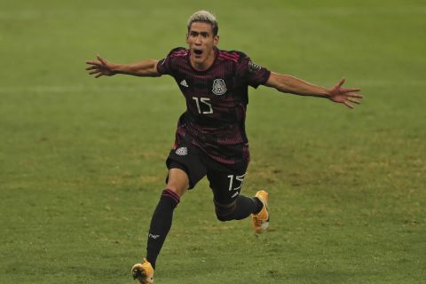 Mexico's Uriel Antuna celebrates scoring his side's opening goal during a Concacaf Men's Olympic qualifying championship semi-final soccer match in Guadalajara, Mexico, Sunday, March 28, 2021. (AP Photo/Fernando Llano)