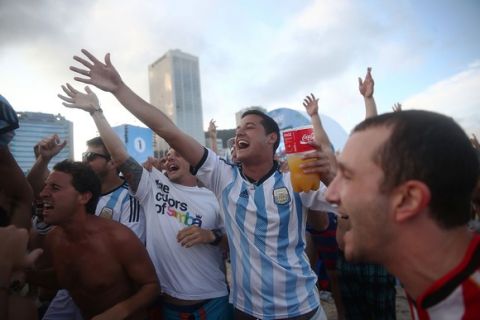 RIO DE JANEIRO, BRAZIL - JULY 09:  Argentina fans gather on Copacabana Beach before the start of their match against the Netherlands in the 2014 FIFA World Cup on July 9, 2014 in Rio de Janeiro, Brazil. The winner advances to the final match at Maracana. (Photo by Mario Tama/Getty Images)