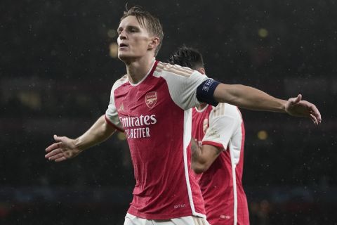 Arsenal's Martin Odegaard celebrates after scoring during the Group B Champion League soccer match, between Arsenal and PSV Eindhoven at the Emirates Stadium in London, Wednesday, Sept. 20, 2023. (AP Photo/Kin Cheung)