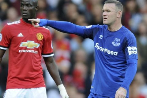 Everton's Wayne Rooney, right, gestures during the English Premier League soccer match between Manchester United and Everton at Old Trafford in Manchester, England, Sunday, Sept. 17, 2017. (AP Photo/Rui Vieira)