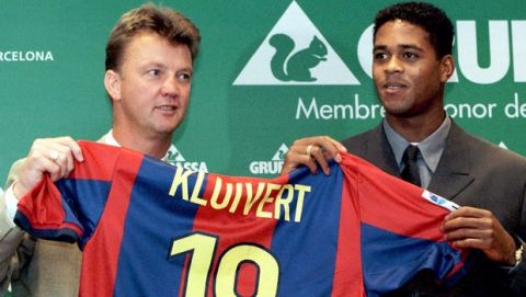 Barcelona's Dutch coach Luis Van Gaal, left, holds the jersey of the team's new Dutch player Patrick Kluivert during his presentation  by the soccer club in Barcelona Tuesday Sept. 1 1998. (AP Photo/Cesar Rangel)