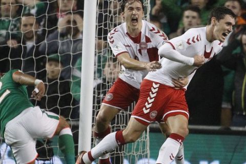 Denmark's Thomas Delaney, left, and Denmark's Andreas Christensen celebrate after scoring during the World Cup qualifying play off second leg soccer match between Ireland and Denmark at the Aviva Stadium in Dublin, Ireland, Tuesday, Nov. 14, 2017. (AP Photo/Peter Morrison)
