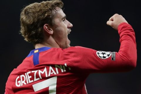 Atletico Antoine Griezmann celebrates after scoring his side's second goal during the Group A Champions League soccer match between Atletico Madrid and Borussia Dortmund at the Wanda Metropolitano stadium in Madrid, Spain, Tuesday, Nov. 6, 2018. (AP Photo/Manu Fernandez)