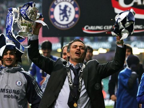 CARDIFF, UNITED KINGDOM: Chelsea manager Jose Mourinho celebrates his team's victory in the English League Cup Final football match against Arsenal at The Millennium Stadium, Cardiff, Wales, 25 February 2007. Chelsea won 2-1. AFP PHOTO / PAUL ELLIS Mobile and website use of domestic English football pictures subject to a subscription of a license with Football Association Premier League (FAPL) tel: +44 207 2981656. For newspapers where the football content of the printed and electronic versions are identical, no license is necessary. (Photo credit should read PAUL ELLIS/AFP/Getty Images)