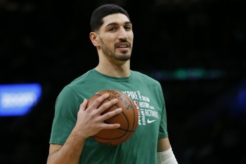 Boston Celtics center Enes Kanter holds a ball during warmups before the start of an NBA basketball game against the Atlanta Hawks, Friday, Feb. 7, 2020, in Boston. (AP Photo/Mary Schwalm)