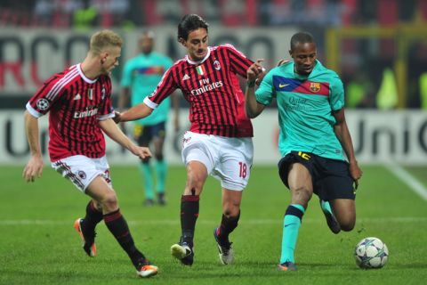 Barcelona's Malian midfielder Seydou Keita  (R) fights for the ball with AC Milan's midfielder Alberto Aquilani (C) and AC Milan's midfielder Ignazio Abateduring the Champions League group H football match AC Milan vs FC Barcelona on November 23, 2011 at San Siro stadium in Milan. AFP PHOTO / GIUSEPPE CACACE (Photo credit should read GIUSEPPE CACACE/AFP/Getty Images)