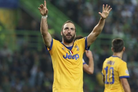 Juventus' Gonzalo Higuain celebrates after scoring his side's opening goal during a Champions League, Group D, soccer match between Sporting CP and Juventus at the Alvalade stadium in Lisbon, Tuesday, Oct. 31, 2017. (AP Photo/Armando Franca)