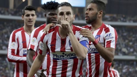 Atletico Madrid's Koke celebrates his goal with teammates during the Spanish Super Cup semifinal soccer match between Barcelona and Atletico Madrid at King Abdullah stadium in Jiddah, Saudi Arabia, Thursday, Jan. 9, 2020. (AP Photo/Hassan Ammar)