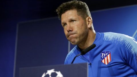 Atletico Madrid coach Diego Simeone arrives for a press conference at Wanda Metropolitano stadium in Madrid, Spain, Tuesday, Feb. 19, 2019. Juventus will play Atletico Madrid in a first leg, round of sixteen, Champions League soccer match on Wednesday. (AP Photo/Andrea Comas)