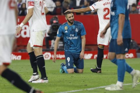 Real Madrid's Benzema, reacts during La Liga soccer match between Sevilla and Real Madrid at the Sanchez Pizjuan stadium, in Seville, Spain on Wednesday, May 9, 2018. (AP Photo/Miguel Morenatti)