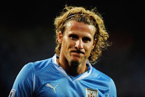 PORT ELIZABETH, SOUTH AFRICA - JULY 10:  Diego Forlan of Uruguay looks on during the 2010 FIFA World Cup South Africa Third Place Play-off match between Uruguay and Germany at The Nelson Mandela Bay Stadium on July 10, 2010 in Port Elizabeth, South Africa.  (Photo by Laurence Griffiths/Getty Images)