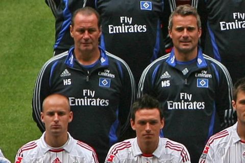 German first division Bundesliga soccer team Hamburger SV is seen during an official photocall in Hamburg, northern Germany, on Thursday, Jul. 26, 2007. Fourth row from left: Kitman Manfred Zielsdorf, Vincent Kompany, Collin Benjamin, Sebastian Langkamp, , Bastian Reinhardt, Otto Addo, Guy Demel, Joris Matthijsen, Kitman Miroslav Zadach. Third row from left: Team doctor Nikolai Linnewitsch, Physiotherapist Uwe Eplinius, Rafael van der Vaart, David Jarolim, Nigel de Jong, Sidney Sam, Masseur Lukas Ditczyk, Masseur Stefan Kliche, Physiotherapist Andrea Mueller. Second row from left: Coach Huub Stevens, Deputy coach Markus Schupp, Golie coach Claus Reitmaier, Anis Ben-Hatira, Paolo Guerrero, Maxim Choupo-Moting, Mario Fillinger, Thimothee Atouba, Athletic coach Markus Guenther, Diagnostician Manfred Duering. Front row from left: Mascot Dino, Miso Brecko, Piotr Trochowski, Raphael Wicky,  Frank Rost, Wolfgang Hesl, Rafael Wolf, Mohamed Zidan, Ivica Olic, and Kosi Saka  (AP Photo/Fabian Bimmer) ** Complete material, headshots, single player actions and more team features are available at <http://apimages.ap.org/unsecured/S.aspx?st=ps&id=520928&oid=150109>  **