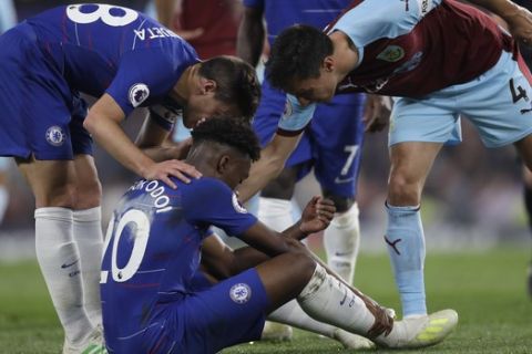Chelsea's Callum Hudson-Odoi gets injured during the English Premier League soccer match between Chelsea and Burnley at Stamford Bridge stadium in London, Monday, April 22, 2019. (AP Photo/Kirsty Wigglesworth)