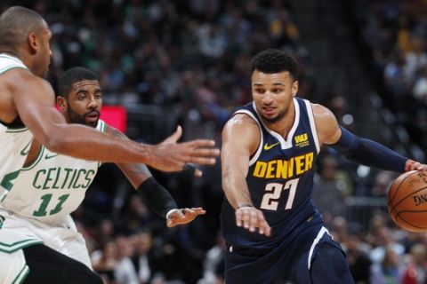 Denver Nuggets guard Jamal Murray, right, drives the lane as Boston Celtics center Al Horford, left, and guard Kyrie Irving, center, defend in the first half of an NBA basketball game Monday, Nov. 5, 2018, in Denver. (AP Photo/David Zalubowski)