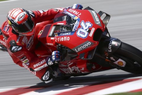 Ducati rider Andrea Dovizioso of Italy steers his Ducati during the MotoGP pre-season test at the Sepang International Circuit, Wednesday, Feb. 6, 2019, in Sepang, Malaysia. (AP Photo/Vincent Phoon)
